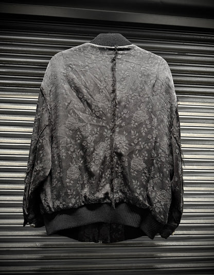 Vintage camouflage jacket on a metallic surface