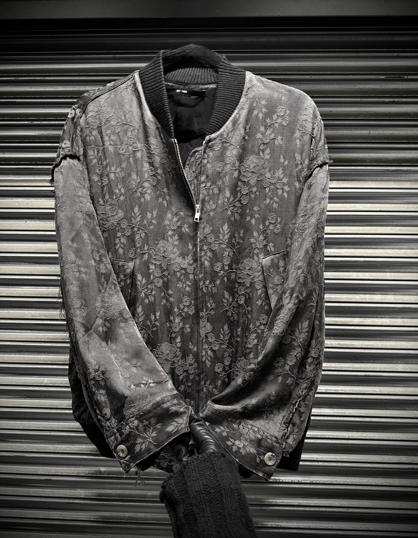 Vintage jacket with floral pattern on a metallic background