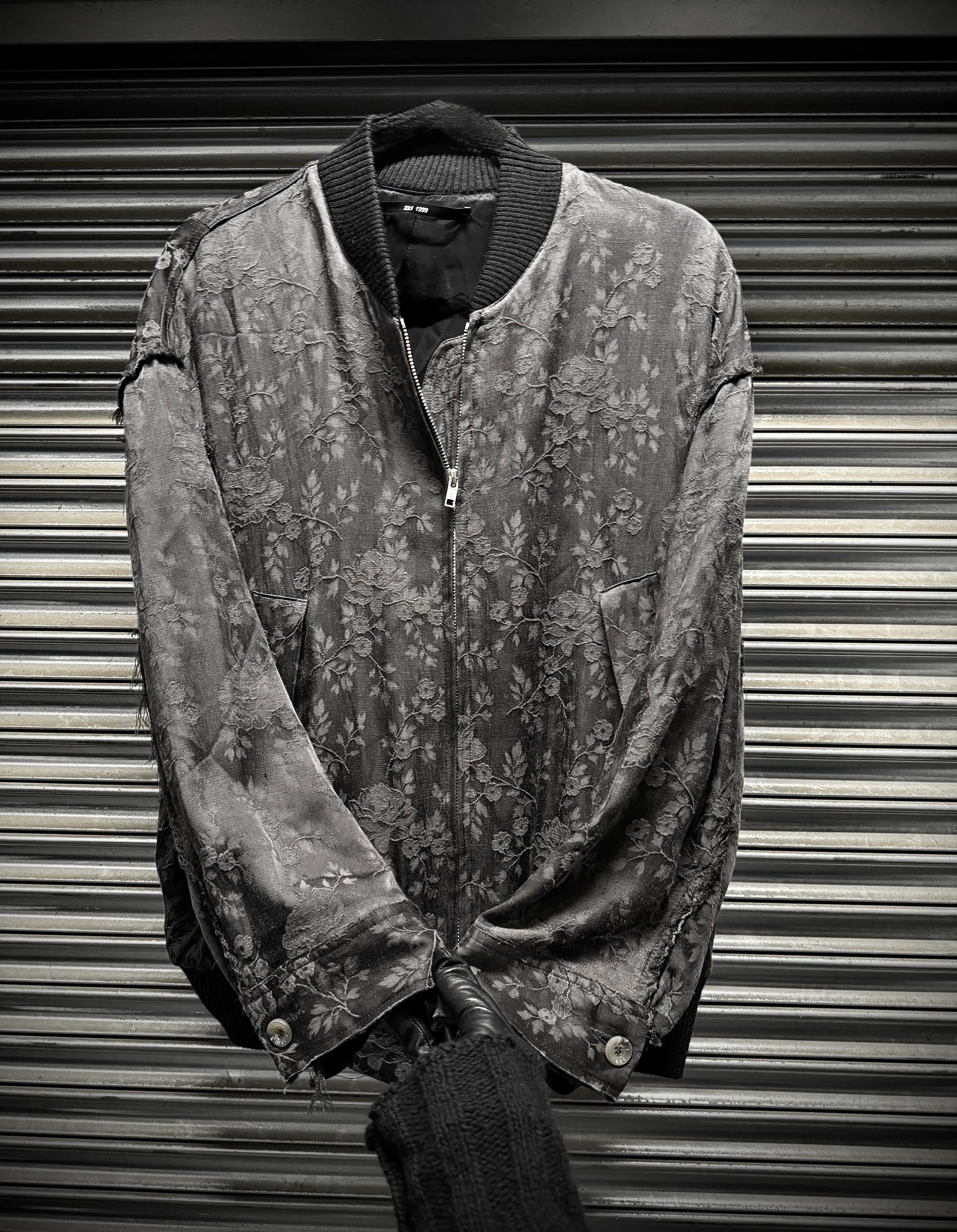 Vintage jacket with floral pattern on a metallic background