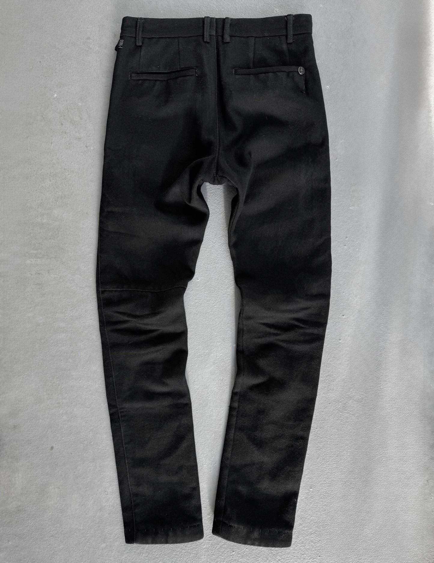 Black pants on a gray background