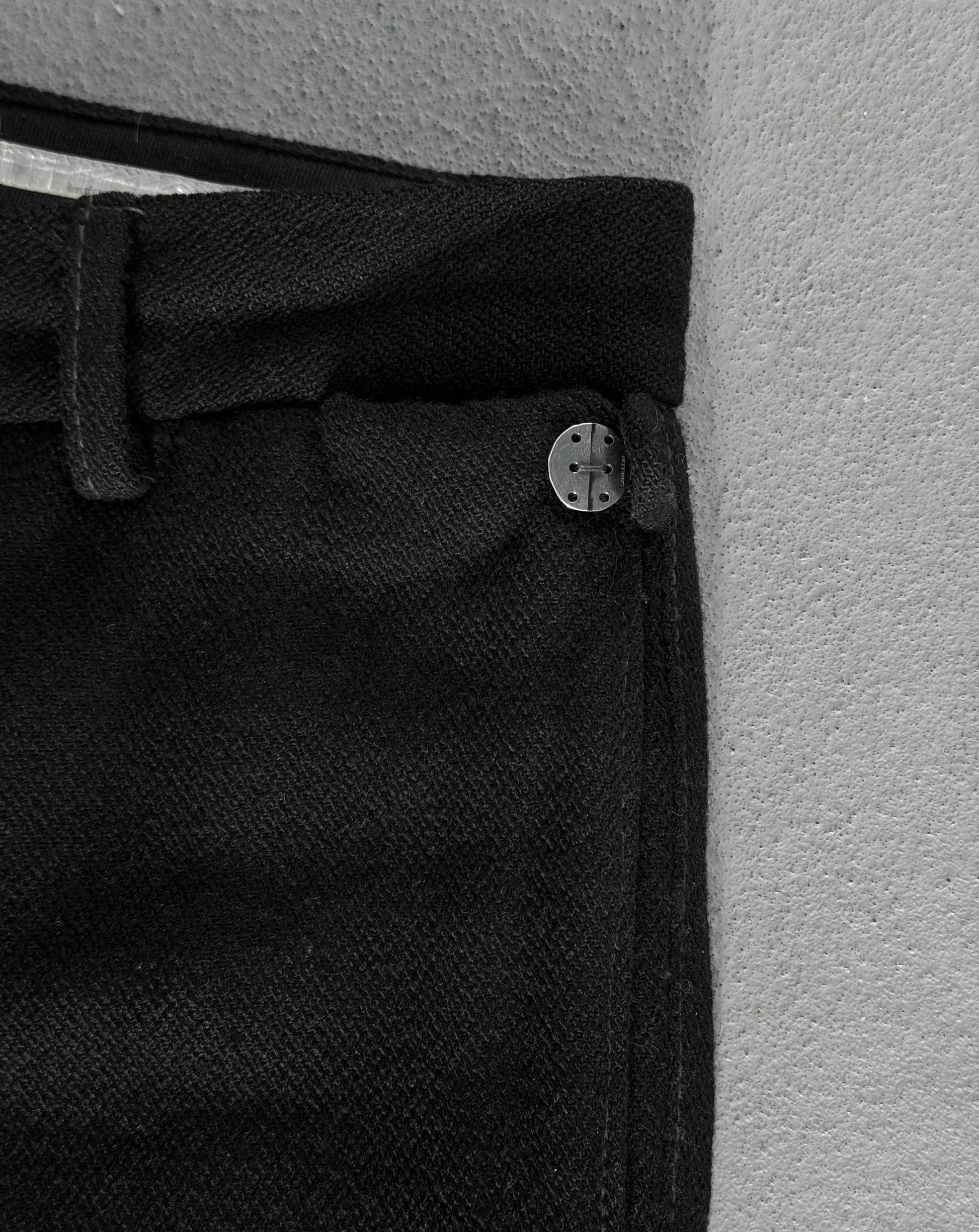 Close-up of a black button on a textured surface