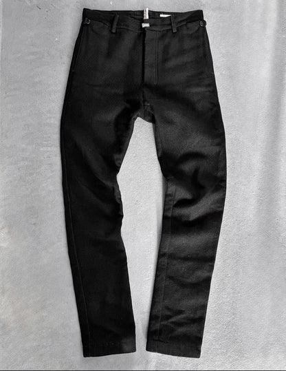 Black pants on a gray textured background