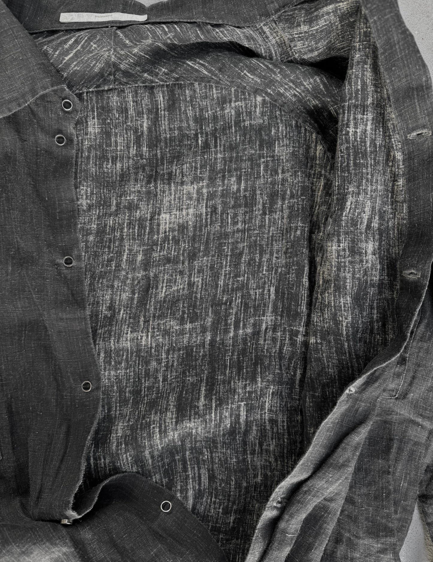 Close-up of a textured fabric with a pattern, possibly denim or cotton.