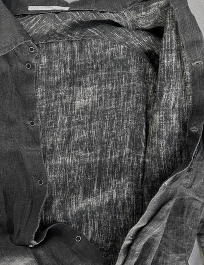 Close-up of a textured fabric with a pattern, possibly denim or cotton.