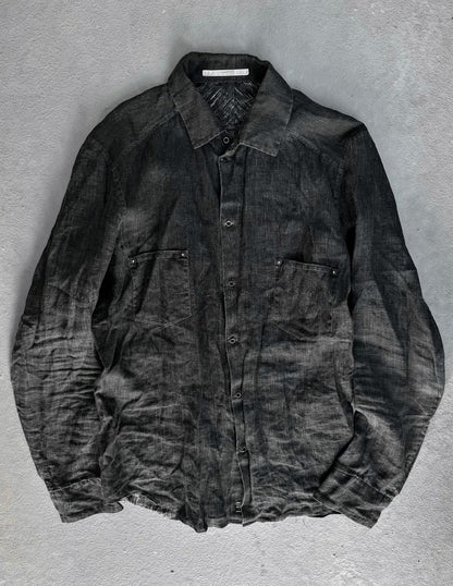 Dark gray shirt on a textured gray background