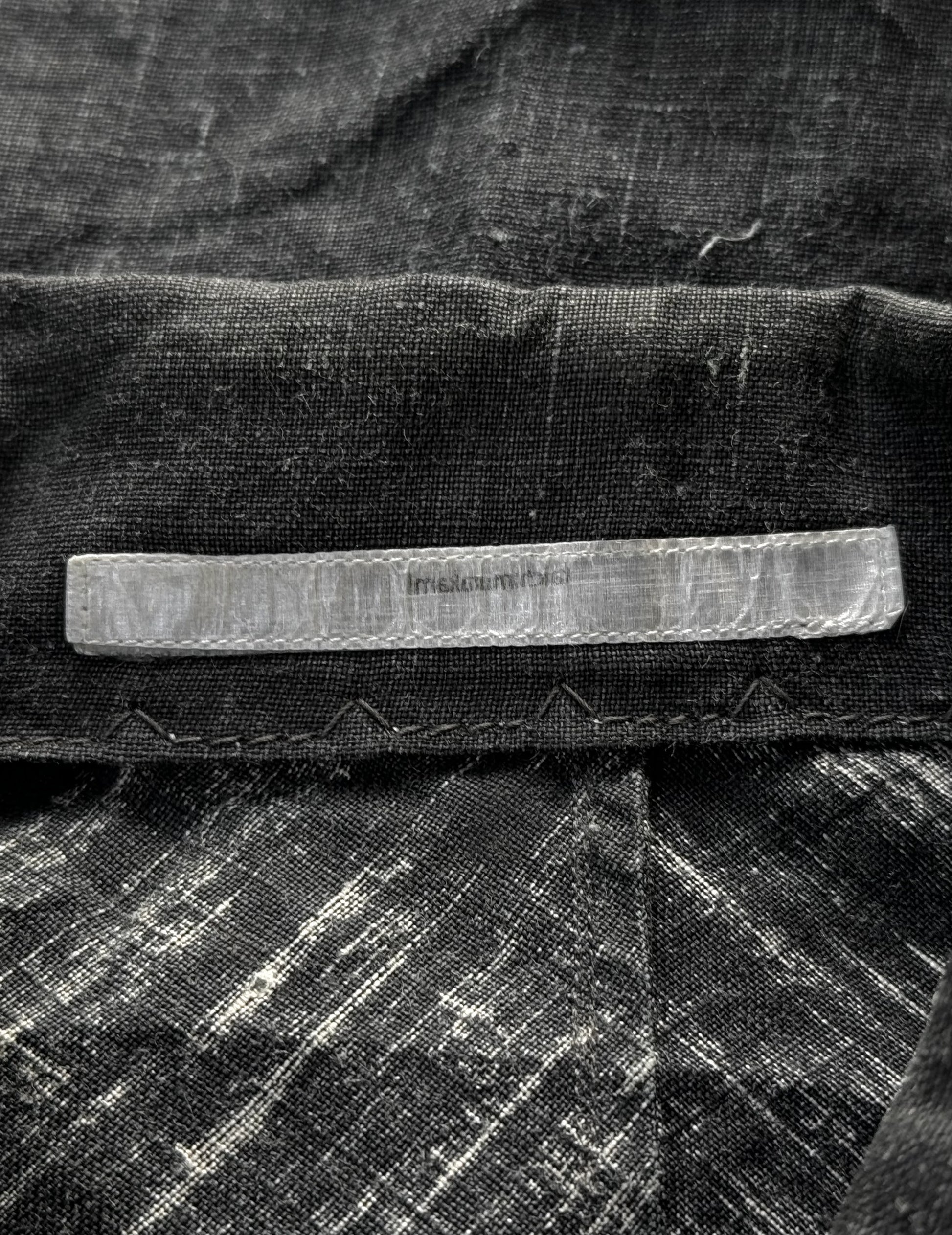 Close-up of a textured fabric surface with a rectangular object on top