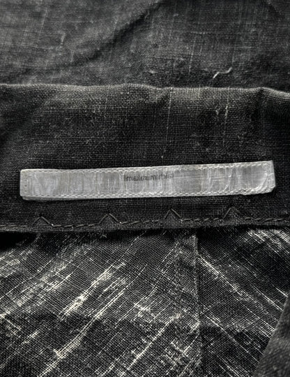Close-up of a textured fabric surface with a rectangular object on top