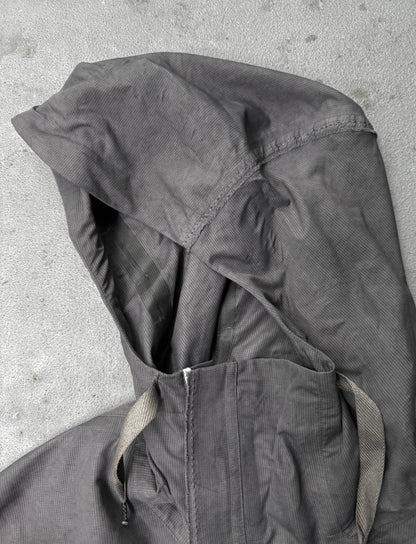 Dark gray jacket with hood on a light gray background