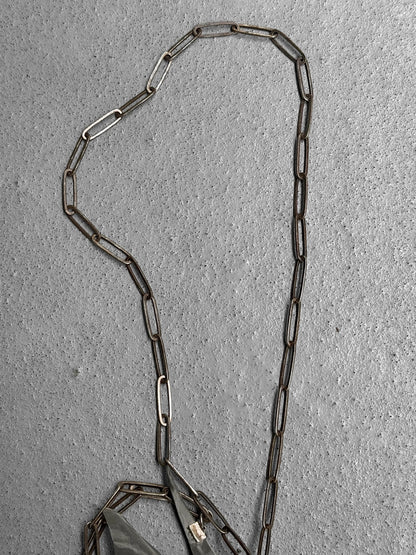Metal chain on a textured gray surface