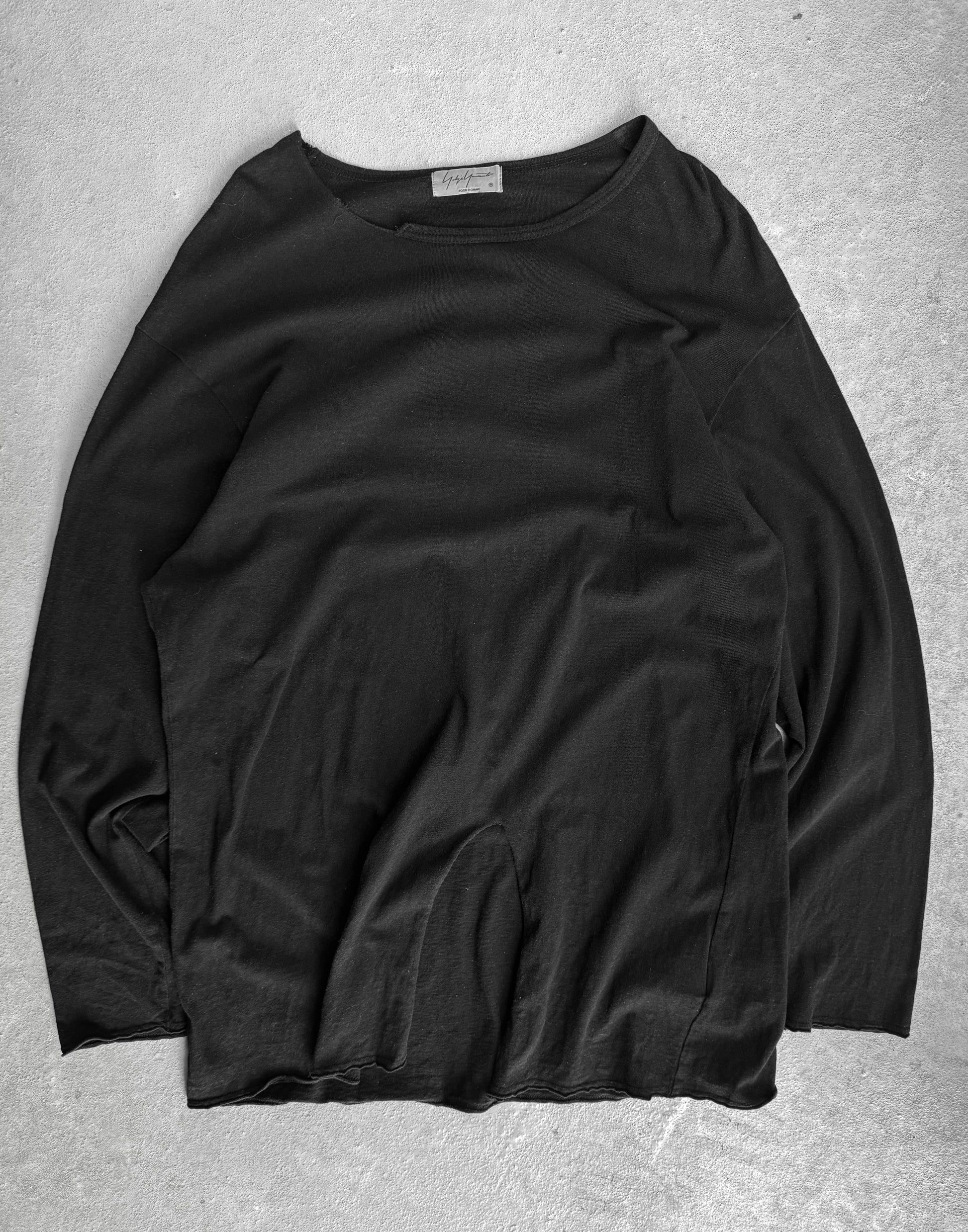 Black long-sleeve shirt on a gray background