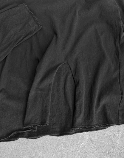 Close-up of a black jacket on a textured surface